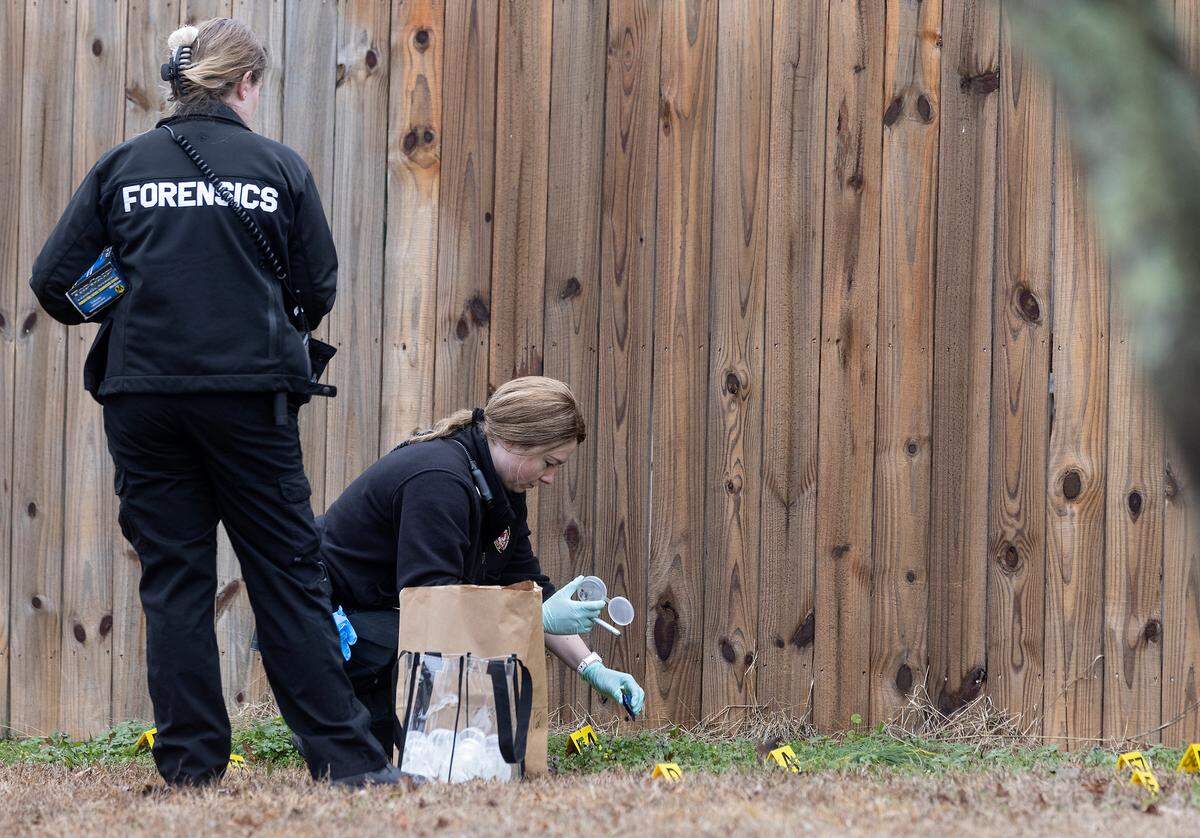 Law enforcement work the scene of a shooting near the intersection of Sudbury Road and Stratton Way in Durham, N.C. on Tuesday, Jan. 31, 2023.