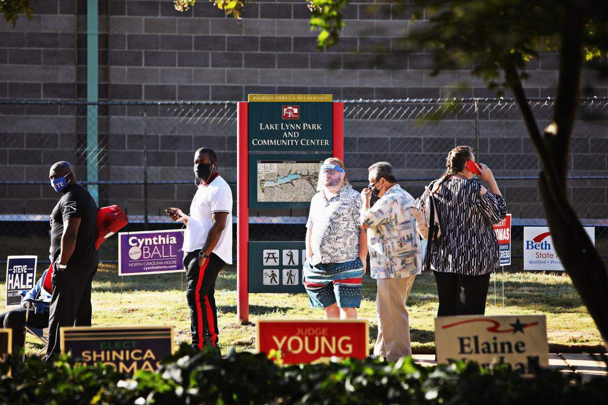 Voters stand in a long line for early voting at Lake Lynn Community Center in Raleigh on Thursday morning, Oct. 15, 2020.