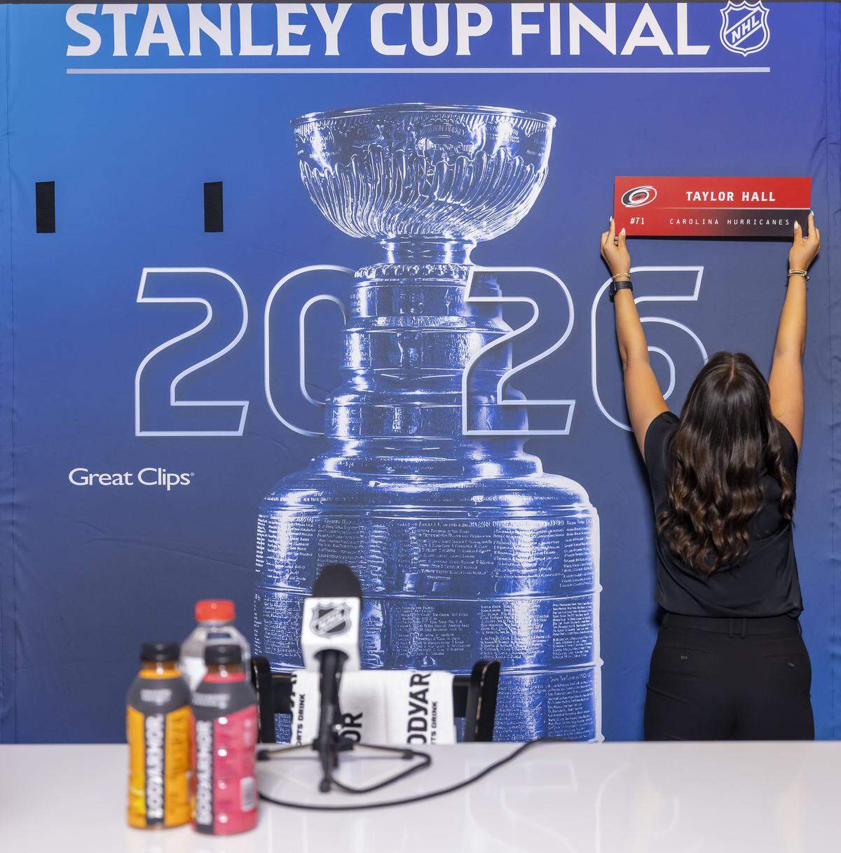 Playoff staff install a name plate for Carolina Hurricanes left wing Taylor Hall (71) during The Stanley Cup media day, on Monday June 1, 2026 at Lenovo Center in Raleigh, N.C.