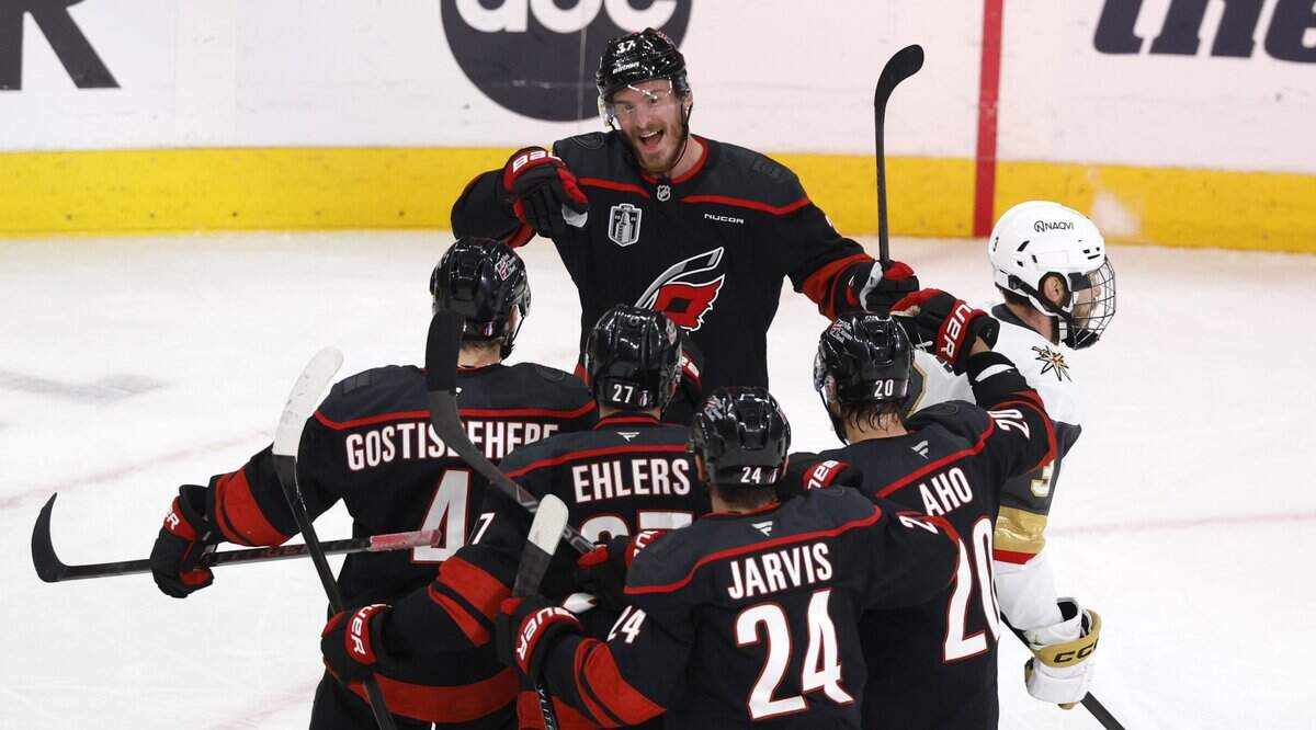 Carolina's Andrei Svechnikov (37) celebrates with teammates after scoring in the third period of the Hurricanes’ 4-2 victory over the Golden Knights in the fifth game of the Stanley Cup Final at the Lenovo Center in Raleigh, N.C., Thursday, June 11, 2026.