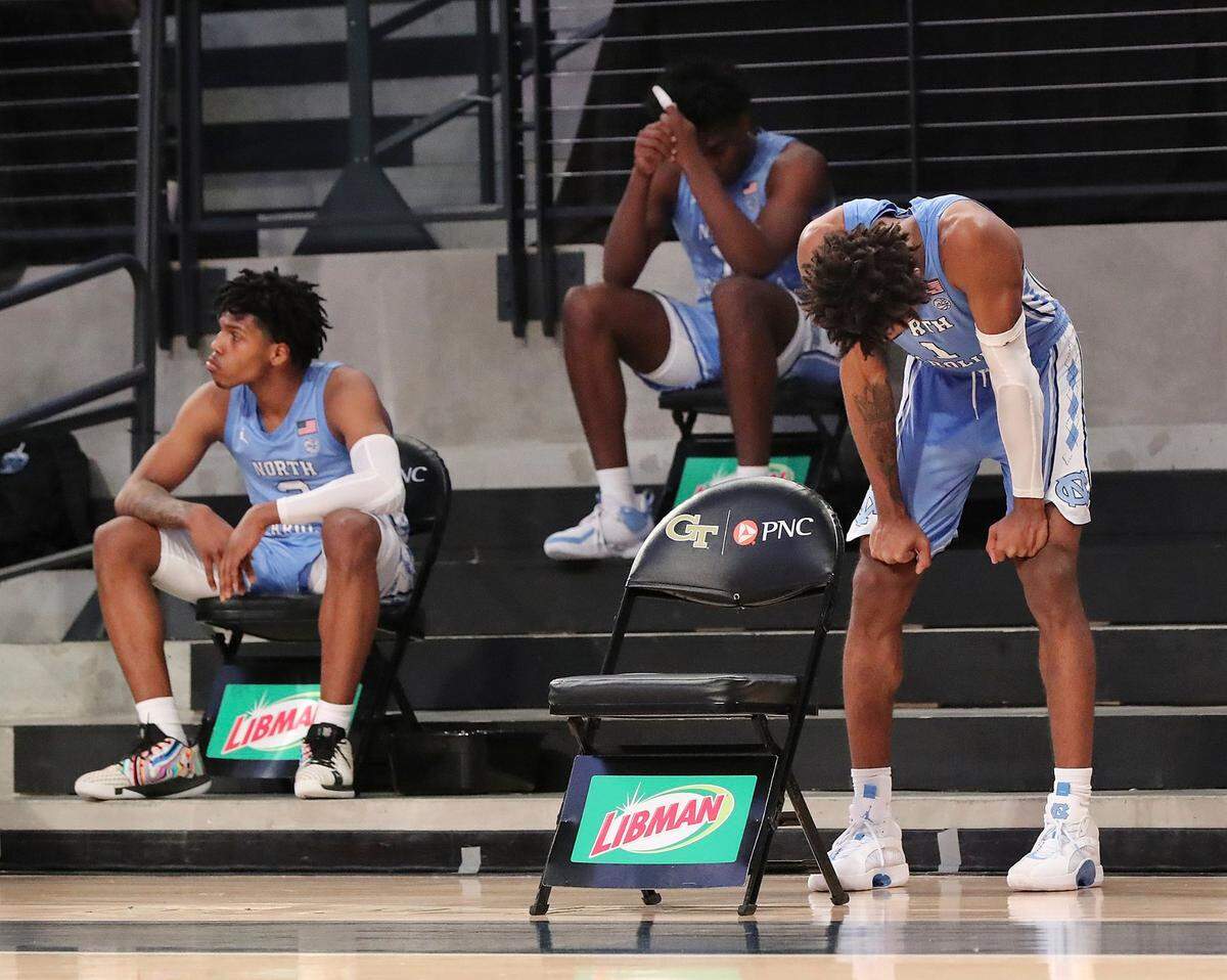 North Carolina guard Rechon Black, right, and the bench react to the team’s loss to Georgia Tech in an NCAA college basketball game Wednesday, Dec. 30, 2020, in Atlanta.