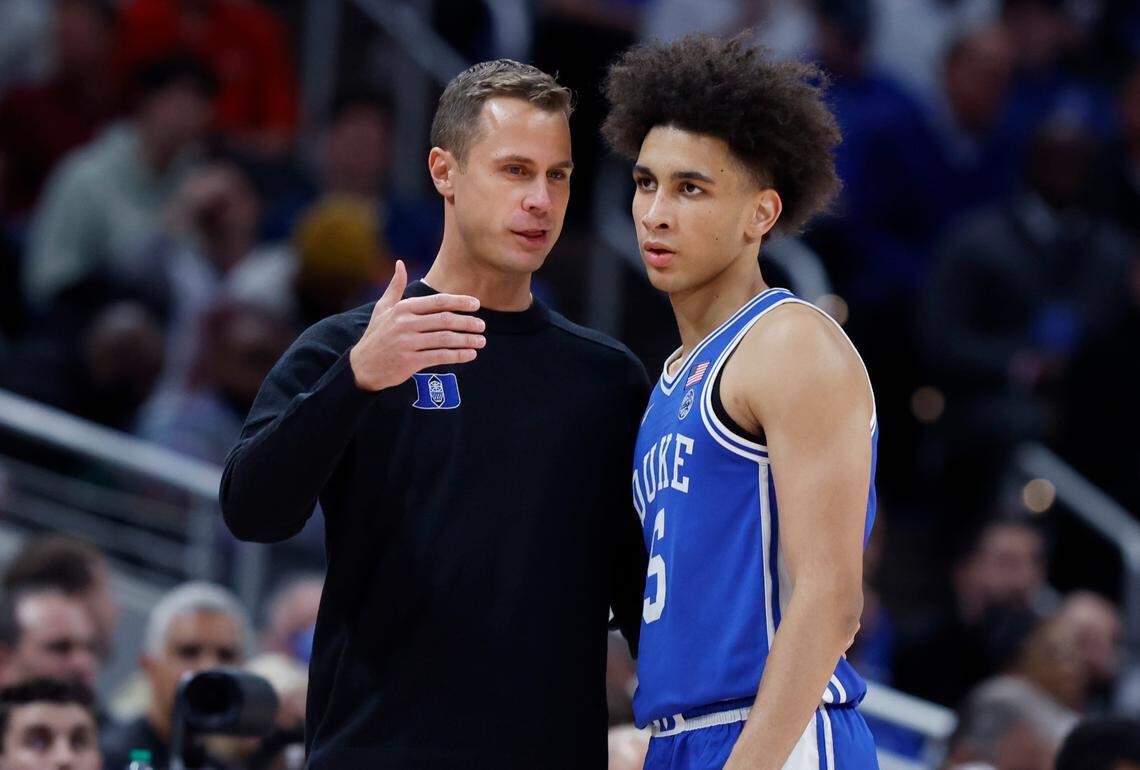 Duke head coach Jon Scheyer talks with Tyrese Proctor (5) during the first half of Duke’s game against Kansas in the State Farm Champions Classic in Indianapolis, Ind. Tuesday, Nov. 15, 2022.