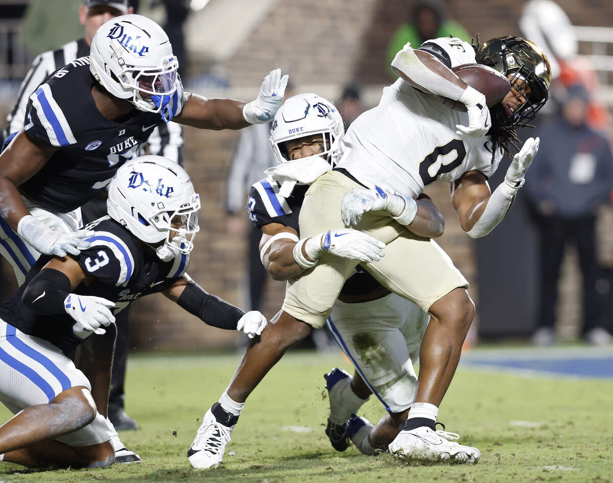 Duke’s Kendall Johnson tackles Wake Forest’s Ty Clark during the second half of the Blue Devils’ 49-32 on Saturday, Nov. 29, 2025, at Wallace Wade Stadium in Durham, N.C.