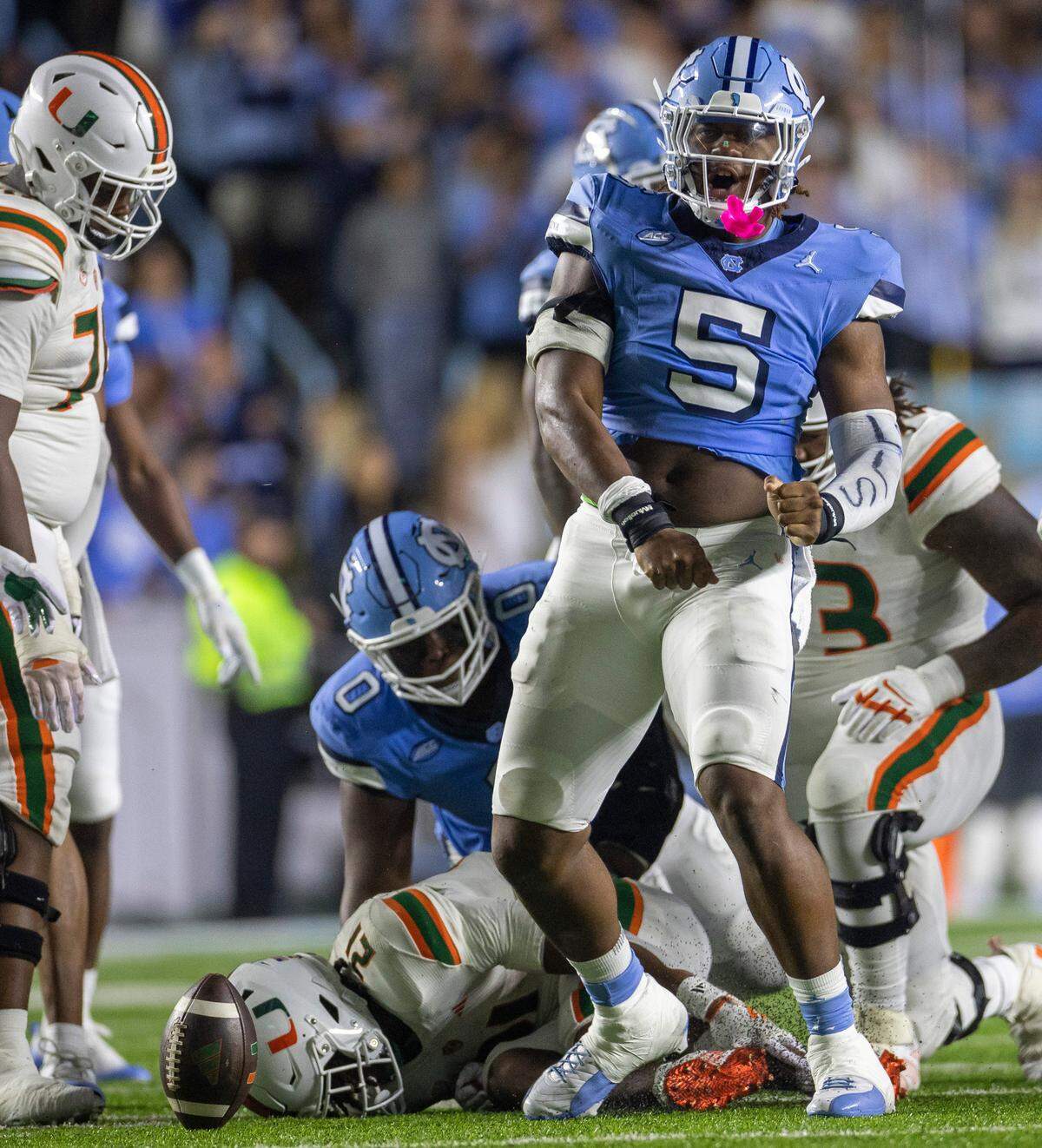 North Carolina’s Jahvaree Ritzie (5) reacts after stopping Miami’s Henry Parrish Jr. (21) for a one-yard gain in the third quarter on Saturday, October 14, 2023 at Kenan Stadium in Chapel Hill, N.C.