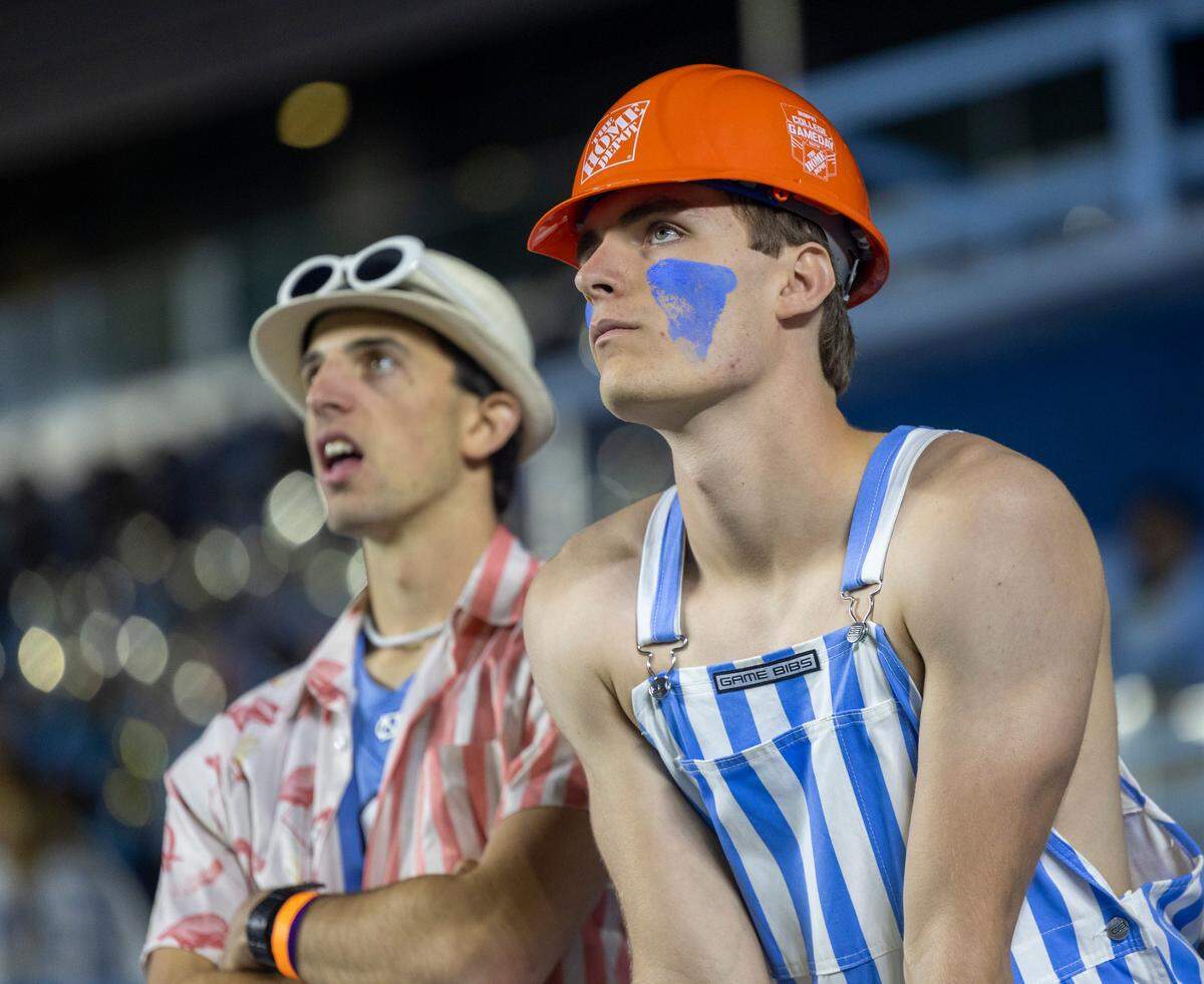 Fans in the North Carolina student section react after Virginia scored to take a 31-27 lead in the fourth quarter on Saturday, October 21, 2023 at Kenan Stadium in Chapel Hill, N.C.