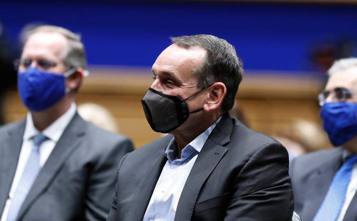 Duke coach Mike Krzyzewski watches as Jon Scheyer speaks after being introduced as Duke basketball’s 20th head coach during a press conference at Cameron Indoor Stadium in Durham, N.C., Friday, June 4, 2021.