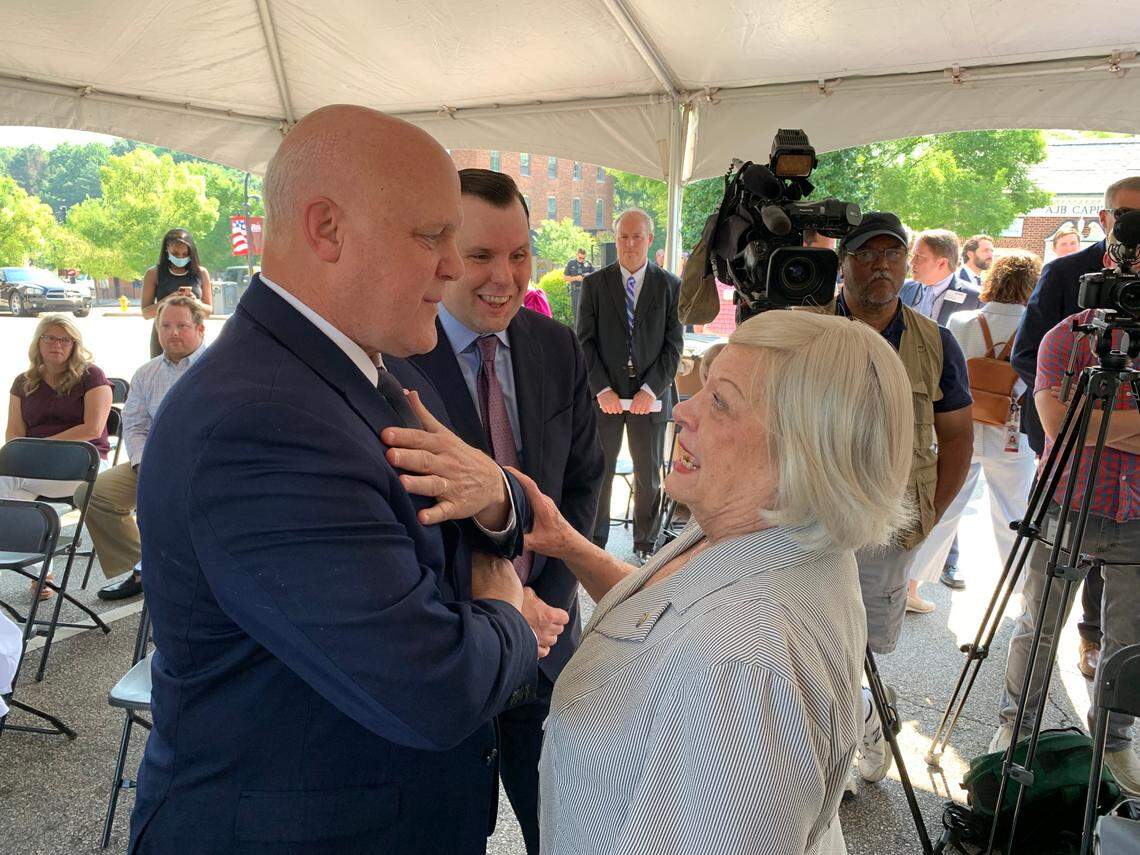 Mitch Landrieu, former mayor of New Orleans, talks with Wake Forest Mayor Vivian Jones on June 2, 2022. Landrieu is overseeing implementation of the $1 trillion infrastructure bill Congress passed last fall and was in Wake Forest to announce a $57.9 million federal grant for engineering work needed to establish high-speed passenger rail service between Raleigh and Richmond, Virginia, that would include a stop in Wake Forest.