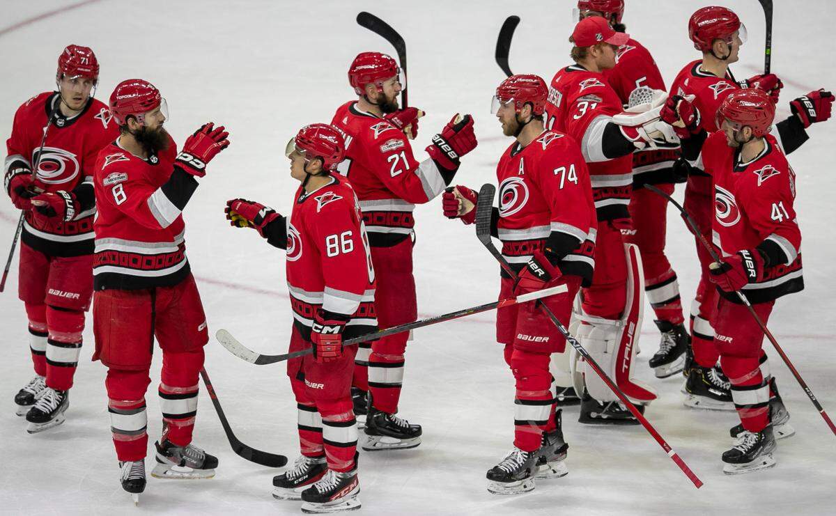 Carolina’s Hurricanes’ Teuvo Teravainen (86) and Jaccob Slavin (74) celebrate the Hurricanes’ 2-1 victory over the New York Islanders with teammates on Monday, April 17, 2023 at PNC Arena in Raleigh, N.C.