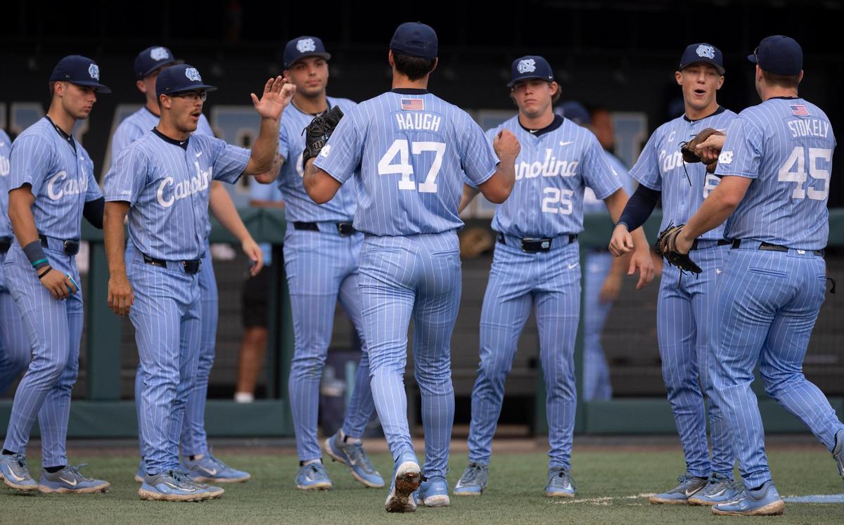North Carolina starting pitcher Aidan Haugh (47) is welcomed to the dugout by teammates after completing the first inning against Oklahoma during Game 6 of the NCAA Chapel Hill Regional on Sunday, June 1, 2025 at Boshamer Stadium in Chapel Hill, N.C.