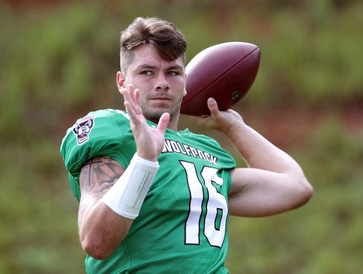 N.C. State quarterback Bailey Hockman (16) warms up before the Wolfpack’s practice in Raleigh, N.C. Tuesday, August 6, 2019.