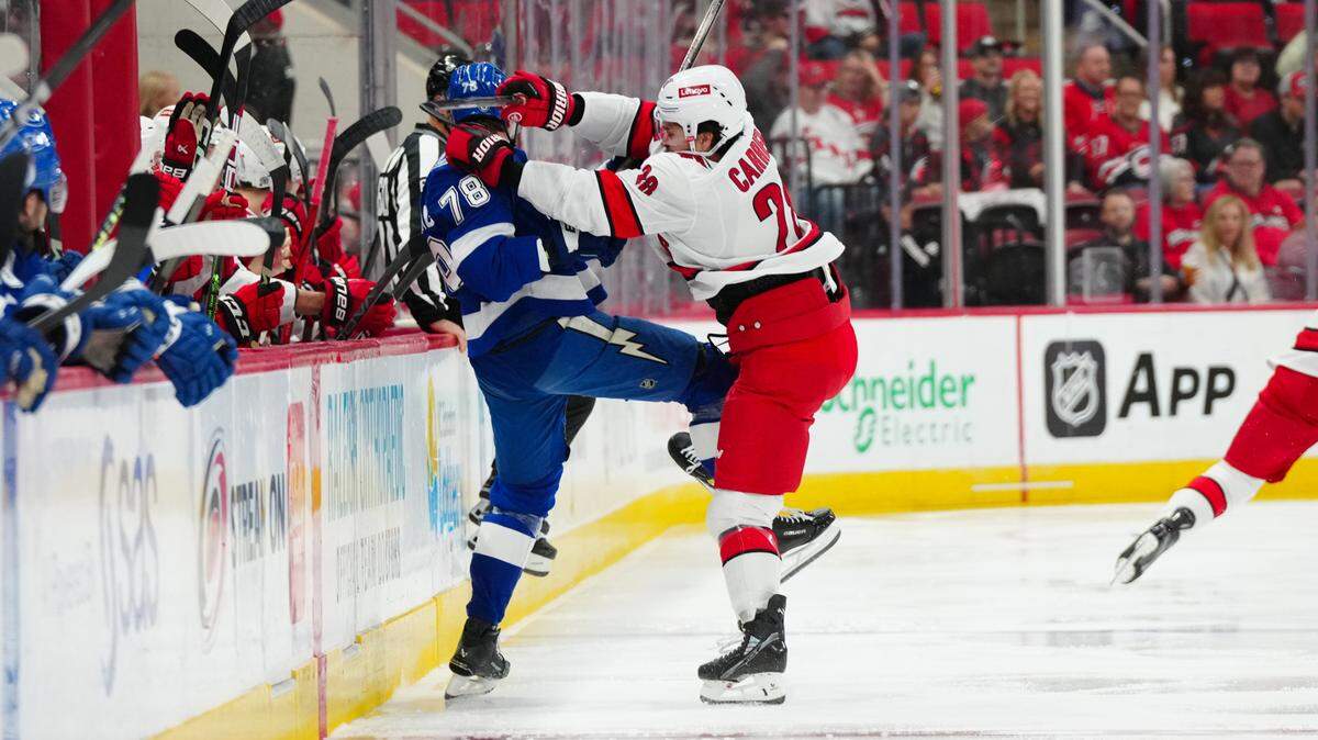 Carolina Hurricanes left wing William Carrier (28) checks Tampa Bay Lightning defenseman Emil Lilleberg (78) during the first period at PNC Arena.