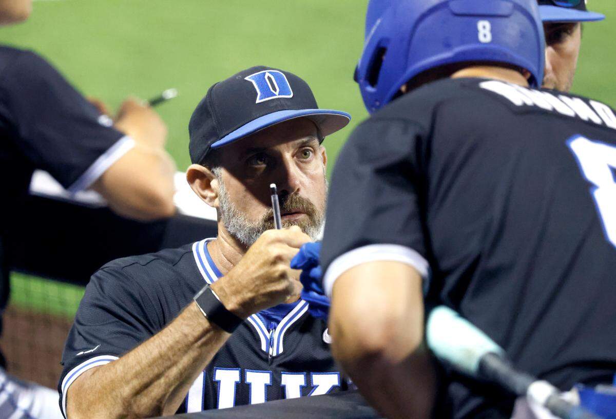Duke coach Chris Pollard bumps fists with Ben Rounds (8) during Murray State’s 5-4 victory over Duke in the third game of the Durham Super Regional at Jack Coombs Field in Durham, N.C., Monday, June 9, 2025.
