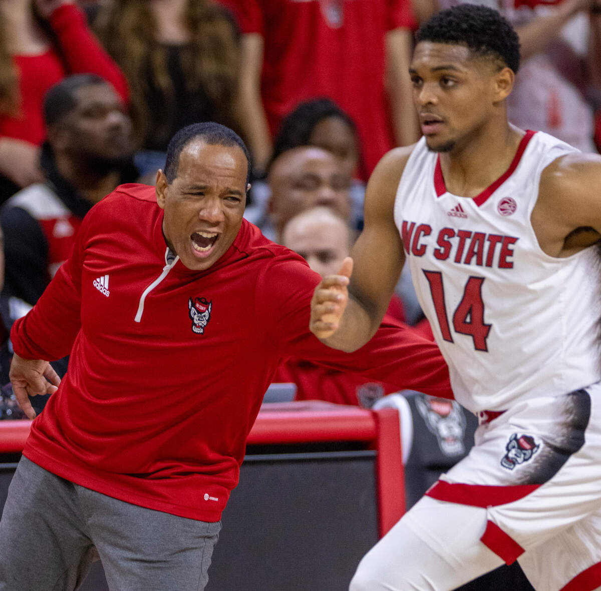 N.C. State coach Kevin Keatts gives Casey Morsell (14) some encourgaement in the first half against North Carolina on Wednesday, January 10, 2024 at PNC Arena in Raleigh, N.C.