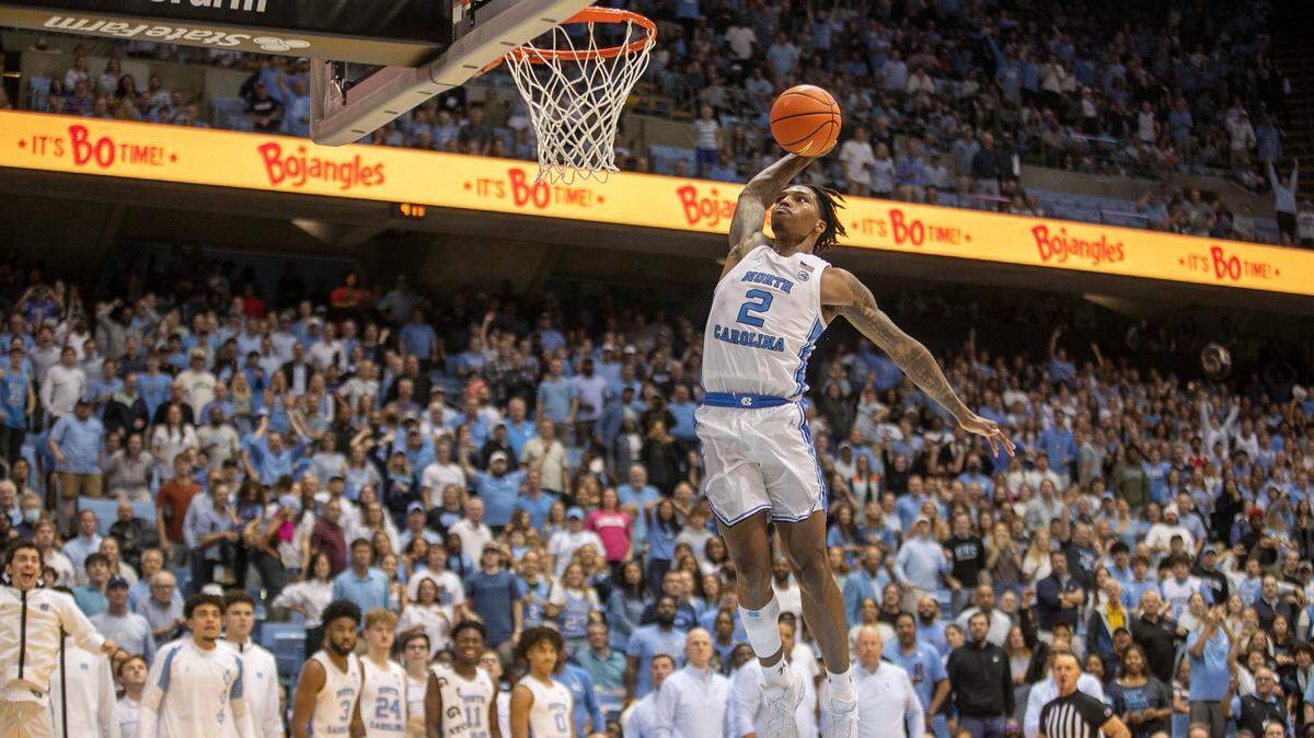North Carolina’s Caleb Love (2) goes to the basket for a dunk to give the Tar Heels a 102-84 lead against College of Charleston in the final seconds of play on Friday, November 11, 2022 at the Smith Center in Chapel Hill, N.C.