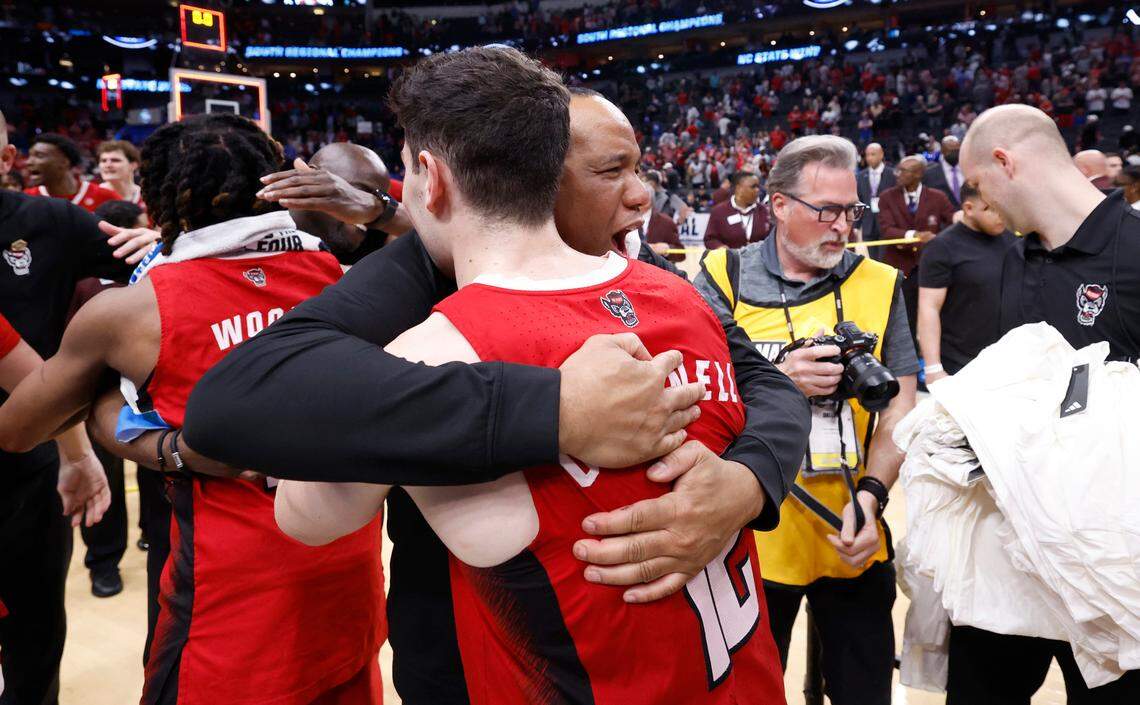 N.C. State head coach Kevin Keatts hugs Michael O’Connell (12) after the Wolfpack’s 76-64 victory over Duke in their NCAA Tournament Elite Eight matchup at the American Airlines Center in Dallas, Texas, Sunday, March 31, 2024.