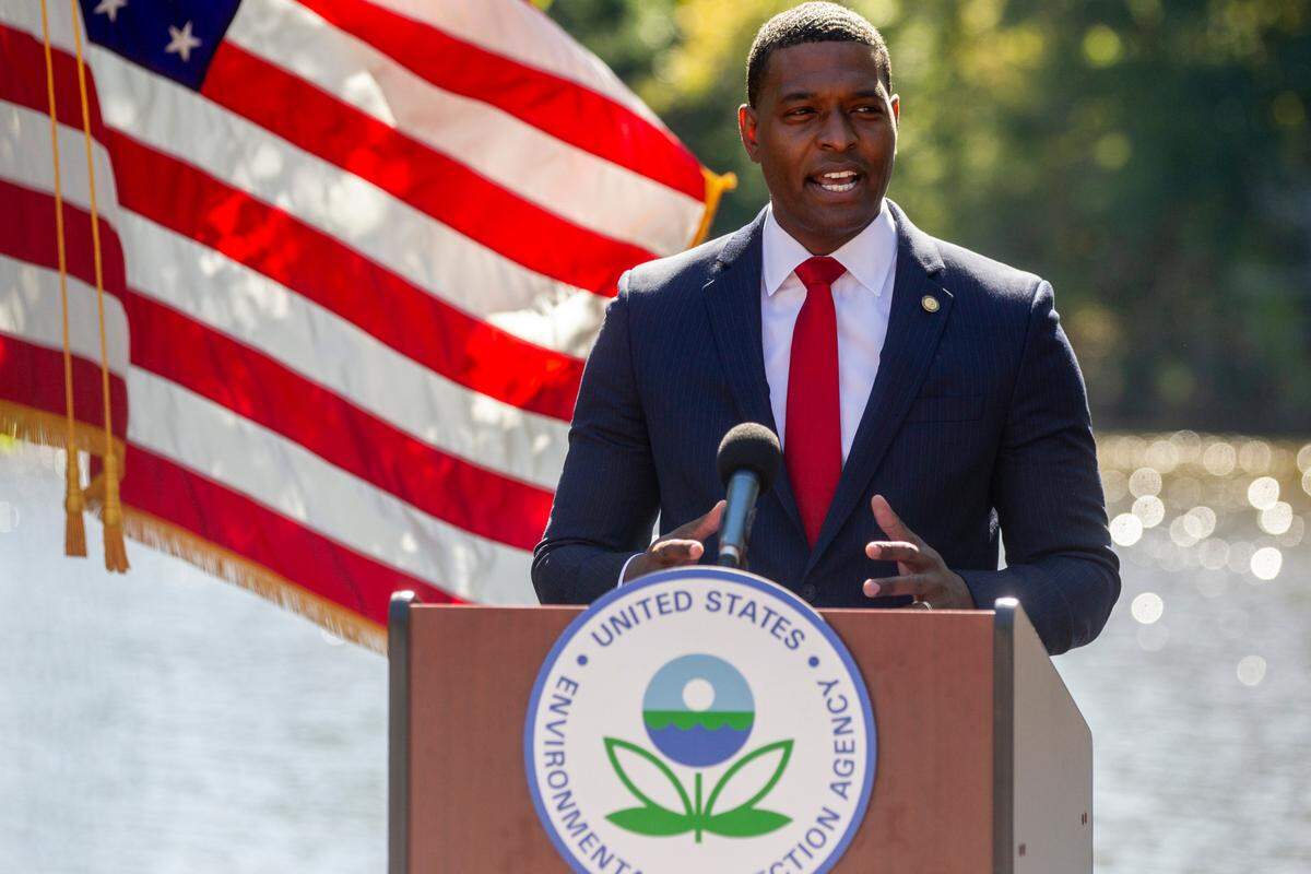 Environmental Protection Agency Administrator Michael Regan announces the Biden administration’s plan to address pollution from “forever chemicals,” or PFAS during an event at N.C. State University, Monday, Oct. 18, 2021. The EPA’s PFAS plan sets out to clean up existing contamination, keep additional chemicals from being released, and lead to additional research.