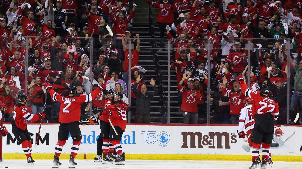 New Jersey Devils center Dawson Mercer (91) celebrates his goal against the Carolina Hurricanes during the third period in game three of the first round of the 2025 Stanley Cup Playoffs at Prudential Center.