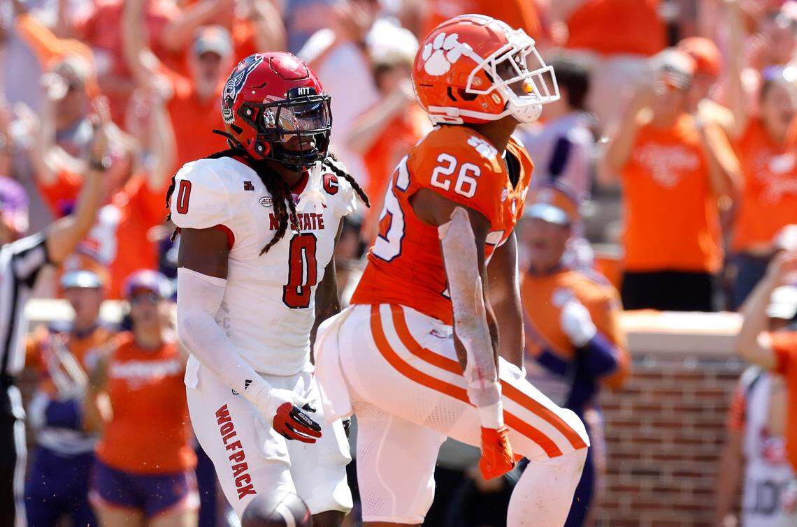 Clemson running back Jay Haynes (26) celebrates scoring on a 19-yard touchdown run as N.C. State linebacker Sean Brown (0) looks on during the first half of N.C. State’s game against Clemson at Memorial Stadium in Clemson, S.C., Saturday, Sept. 21, 2024.