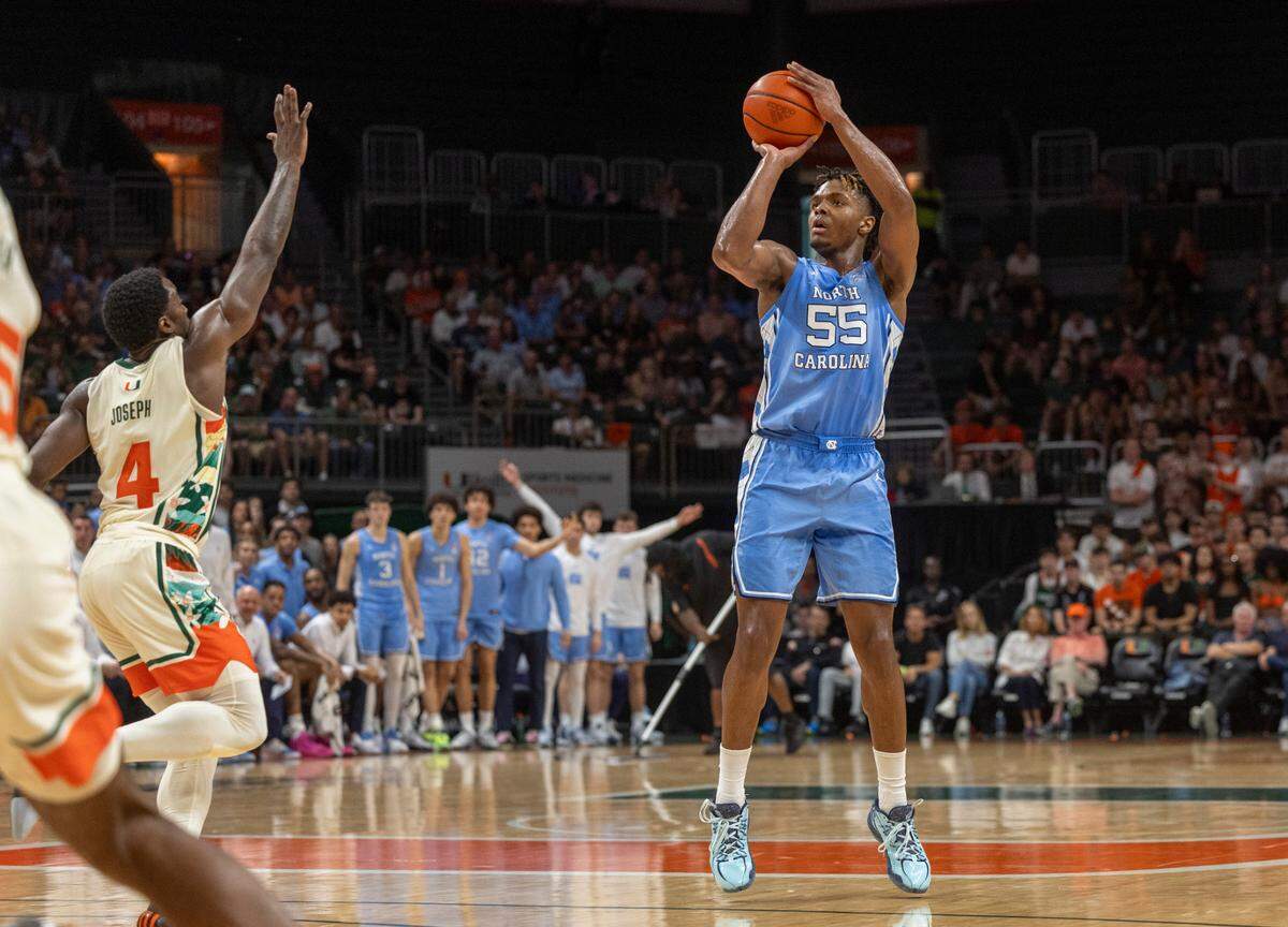 North Carolina’s Harrison Ingram (55) launches a three point shot in the second half against Miami on Saturday, February 10, 2024 at the Watsco Center in Coral Gables, Florida.