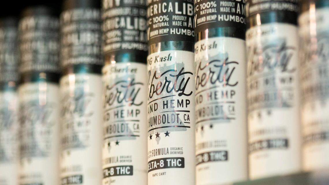 Vape cartridges of Delta 8 THC are displayed on shelves behind the counter in Cannabliss Dispensary, on Wednesday, July 7, 2021, in Chapel Hill, N.C.