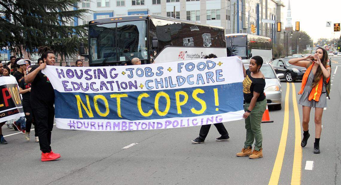 About 175 people rallied Monday evening, March 14, 2016, against a new Durham police headquarters planned for East Main Street downtown. The crowd blocked traffic outside the existing station on West Chapel Hill Street for about 90 minutes while police watched. There were no arrests.