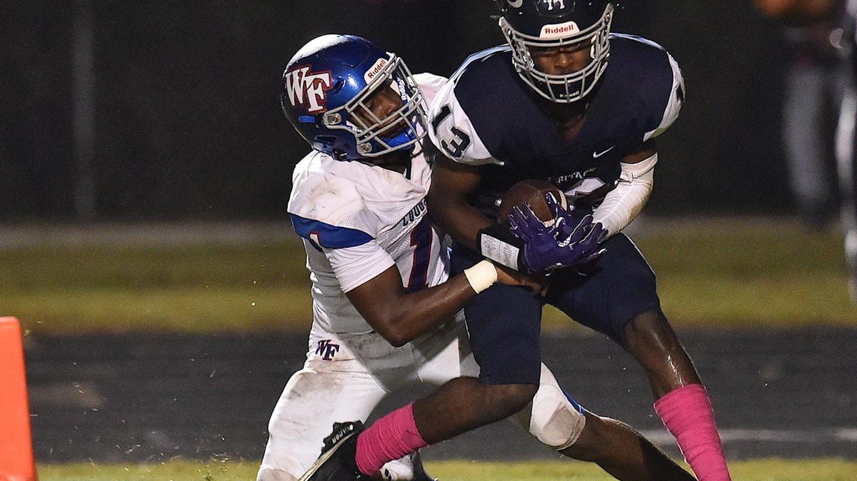 Heritage’s Tavares Carter (13) makes the touchdown catch against Wake Forest’s Nigel Lucas (1) during the second half. The Heritage Huskies and the Wake Forest Cougars met in a football game in Wake Forest, N.C. on October 15, 2021.