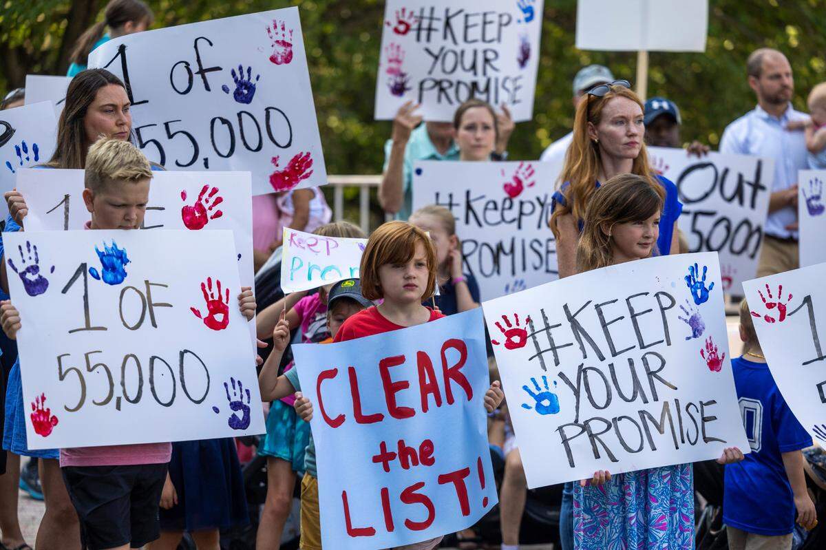Parents and students urge Republican lawmakers to keep their promise to fully fund private school vouchers for the 55,000 students on the Opportunity Scholarship waiting list during a rally on Halifax Mall in Raleigh on Wednesday, July 31, 2024.