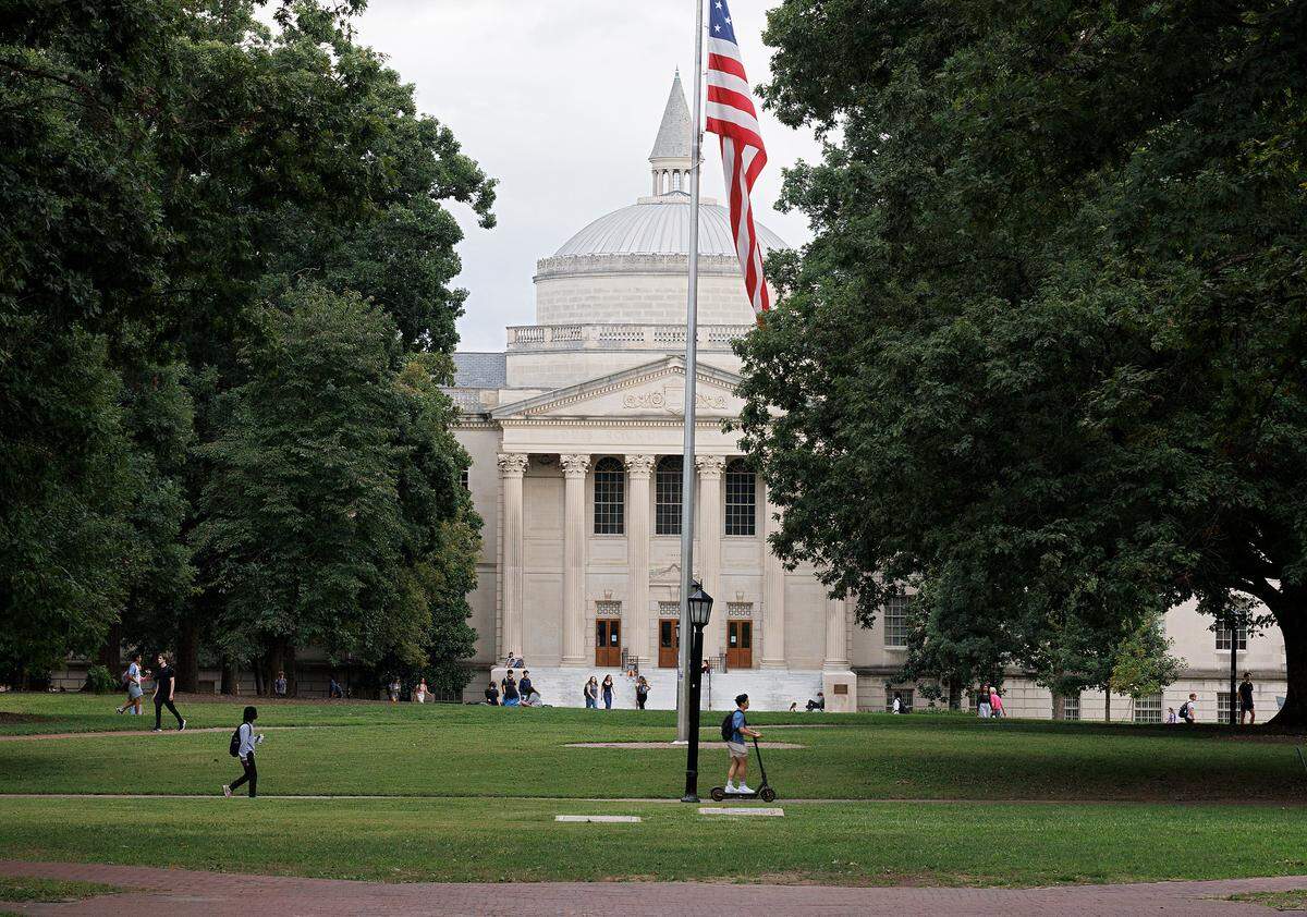 People walk through Polk Place on the campus of UNC-Chapel Hill on Wednesday, Sept. 4, 2024.