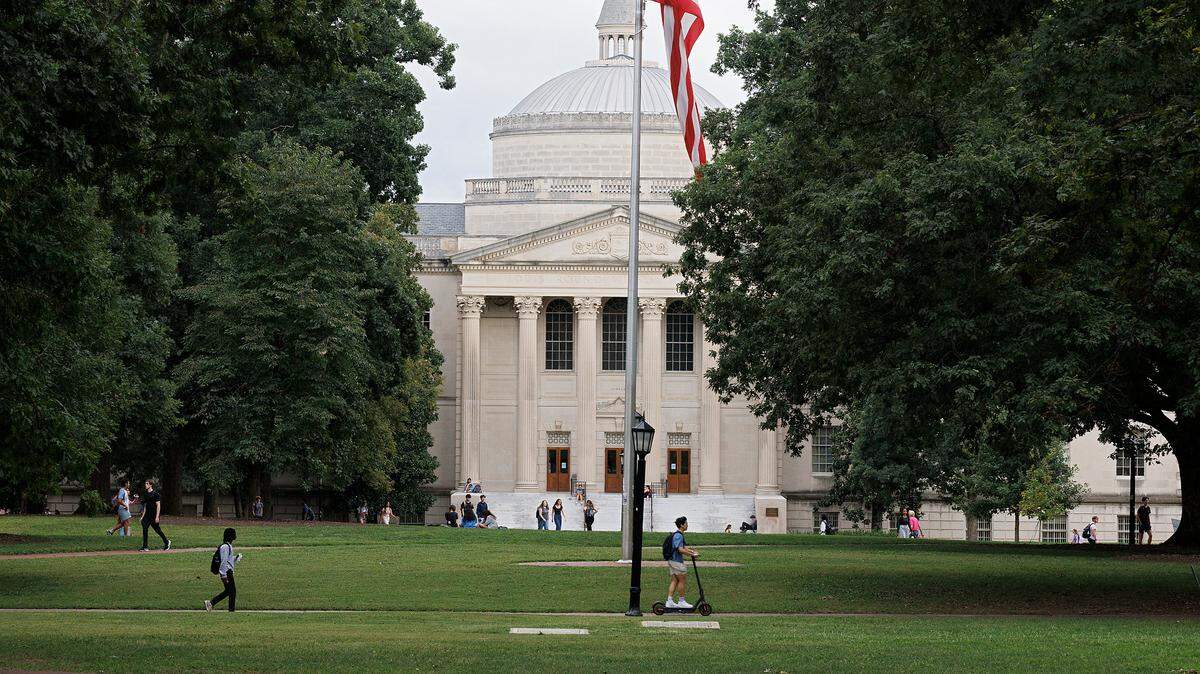 People walk through Polk Place on the campus of UNC-Chapel Hill on Wednesday, Sept. 4, 2024.