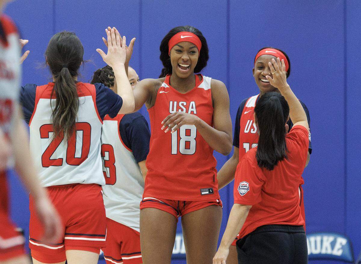Rickea Jackson, center, high-fives Sonia Citron during USA Basketball Women’s National Team training camp on Friday, Dec. 12, 2025, in Durham, N.C.