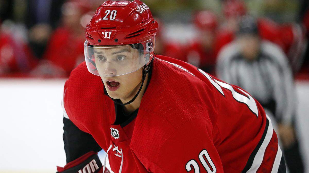 Carolina Hurricanes’ Sebastian Aho (20) waits for a face-off during the third period of an NHL hockey game against the Detroit Red Wings, Saturday, Nov. 10, 2018, in Raleigh, N.C. (AP Photo/Karl B DeBlaker)