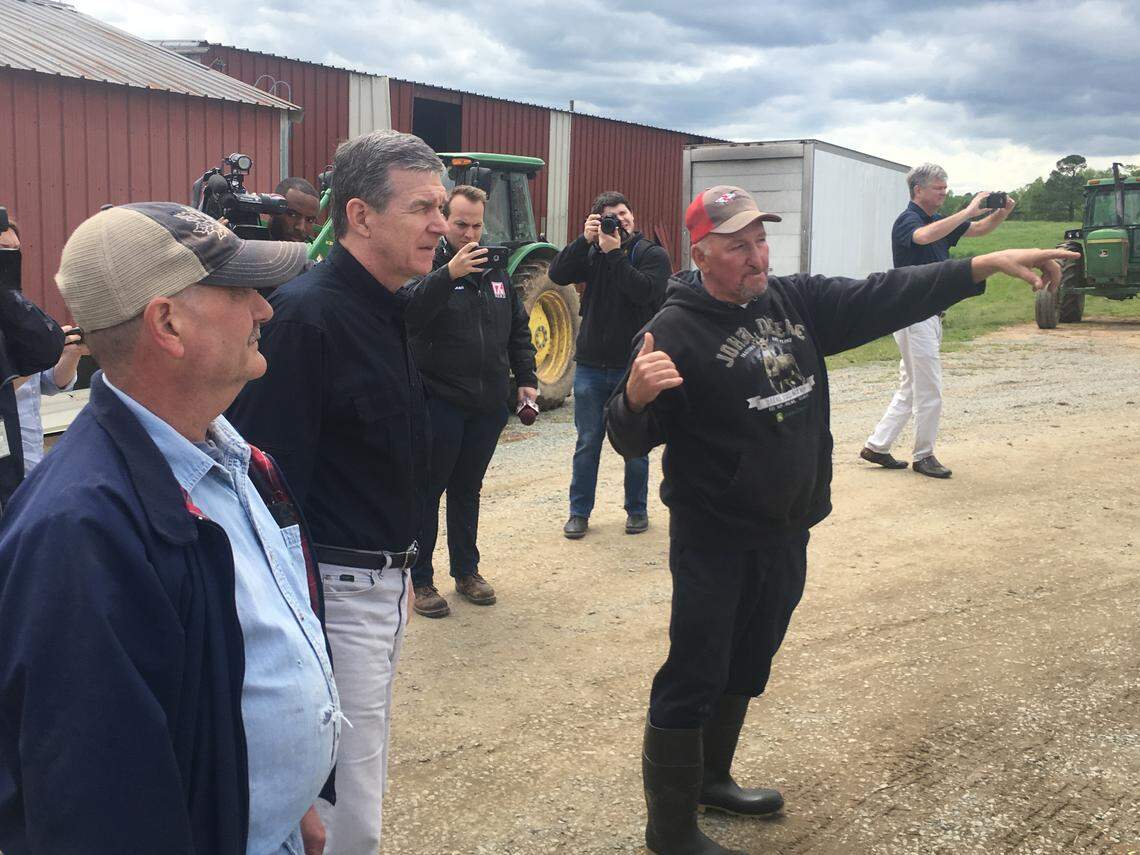 Gov. Roy Cooper tours Maple View Farm in Hillsborough, which was seriously damaged in Friday’s storm. Cooper told staff at the dairy farm, “Everyone is just glad the ice cream was spared.”