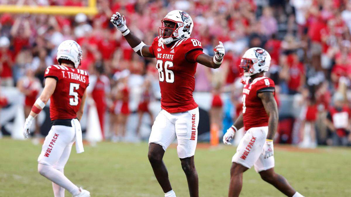 N.C. State wide receiver Emeka Emezie (86), pictured here celebrating against Clemson last month, broke the school’s all-time receptions mark Saturday night at Boston College.