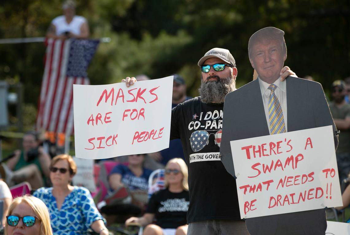 Tyson Stauffer, a parent of a Johnston County student, listens as U.S. Rep. Madison Cawthorn addresses a gathering of fellow demonstrators opposing a mask mandate, outside the Johnston County Board of Education meeting in Smithfield. “The Daily Show” did a segment on the protesters Thursday.