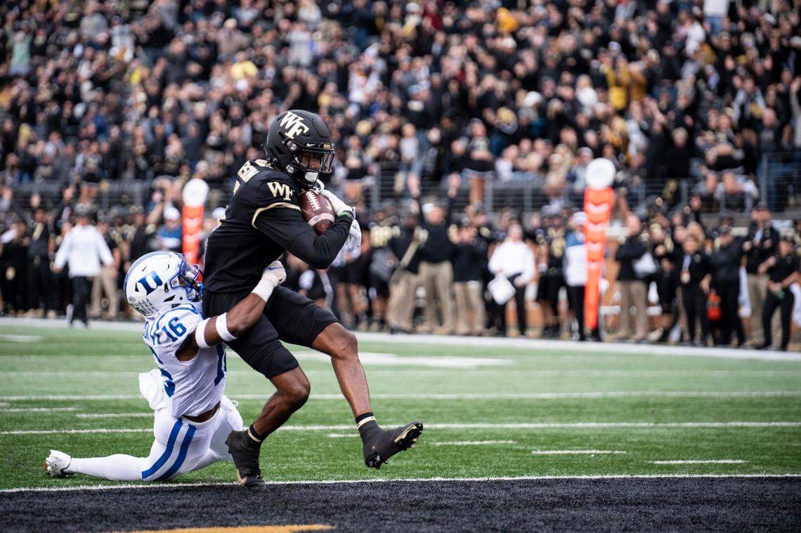 Wake Forest wide receiver Jaquarii Roberson (5) catches a pass for a touchdown during the first half of an NCAA college football game against Duke on Saturday, Oct. 30, 2021, in Winston-Salem, N.C. (AP Photo/Matt Kelley)