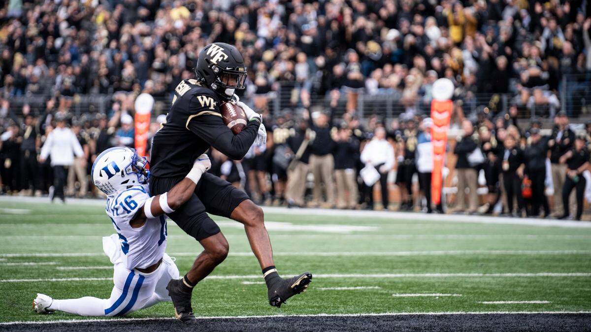 Wake Forest wide receiver Jaquarii Roberson (5) catches a pass for a touchdown during the first half of an NCAA college football game against Duke on Saturday, Oct. 30, 2021, in Winston-Salem, N.C. (AP Photo/Matt Kelley)