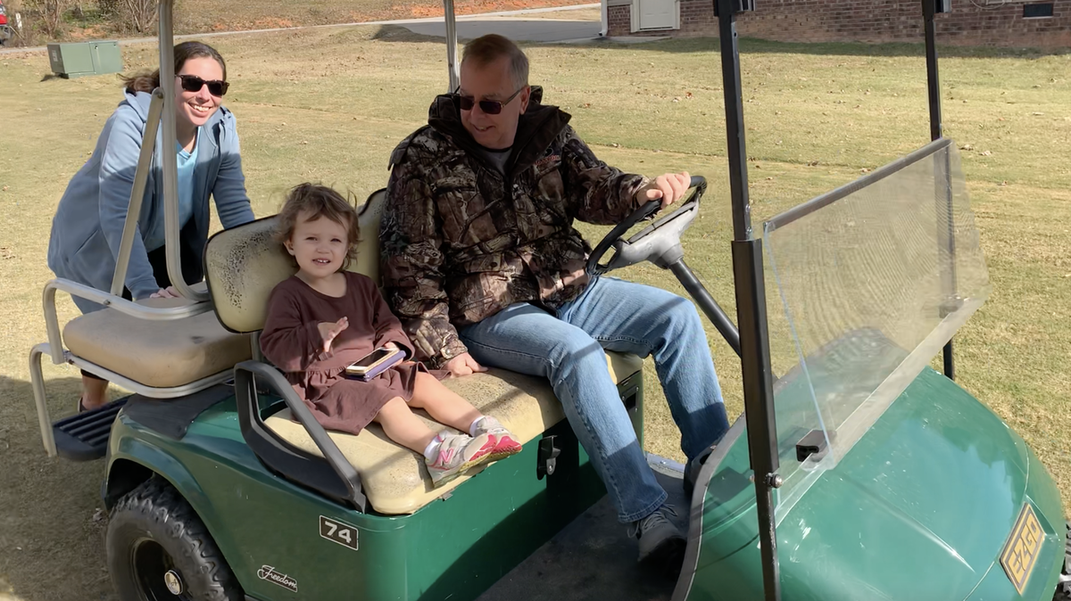 Rachel Bagley of Clayton, N.C. pushes her two-year-old daughter Sara Beth, who is undergoing chemotherapy for a tumor in her brain, in the family’s green golf cart after it was found and returned to them after being stolen on Nov. 17.