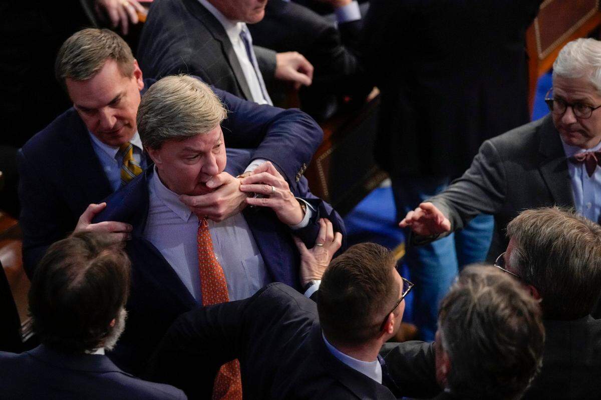 Rep. Richard Hudson, R-N.C., left, pulls Rep. Mike Rogers, R-Ala., back as they talk with Rep. Matt Gaetz, R-Fla., and other during the 14th round of voting for speaker as the House meets for the fourth day to try and elect a speaker and convene the 118th Congress in Washington, Friday, Jan. 6, 2023. At right is Rep. Patrick McHenry, R-N.C.