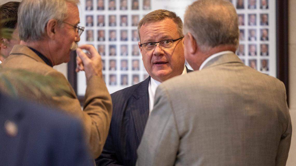 House Speaker Tim Moore confers with other lawmakers outside the House chamber Thursday morning, Sept. 21, 2023 as the House prepares to hold the first of several votes on the budget at the General Assembly.
