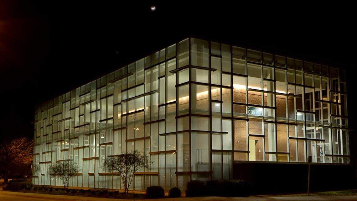 Photo of Cary High School at night. The school is in line to get more than $100 million in renovations that would be completed in 2031.