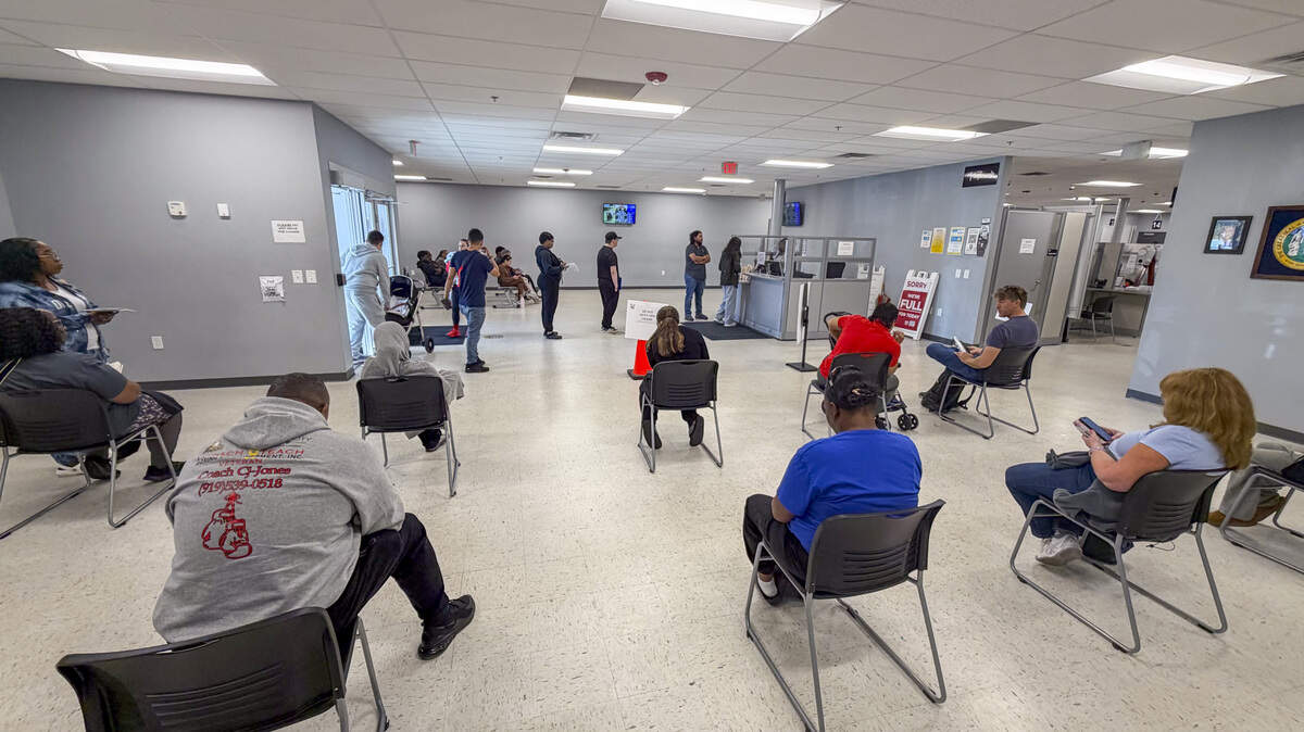 People wait in the lobby of the N.C. Division of Motor Vehicles office on New Bern Avenue in Raleigh on Nov. 4, 2025. Average wait times at driver license offices statewide are a fraction of what they were last summer.