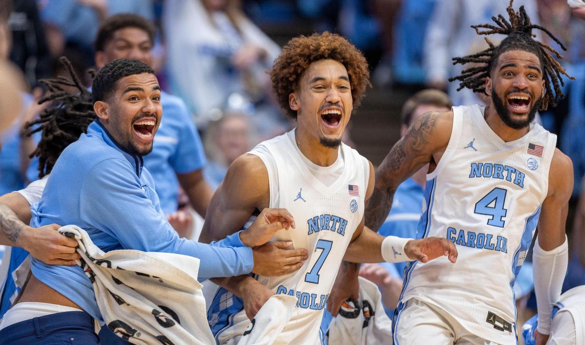 North Carolina players Elijah Davis, Seth Trimble and R.J. Davis react after a dunk by reserve player John Holbrook to seal the Tar Heels’ 127-61 victory over Johnson C. Smith on Sunday, October 27, 2024 at the Smith Center in Chapel Hill, N.C.