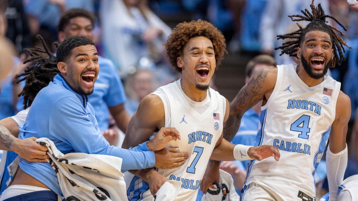 North Carolina players Elijah Davis, Seth Trimble and R.J. Davis react after a dunk by reserve player John Holbrook to seal the Tar Heels’ 127-61 victory over Johnson C. Smith on Sunday, October 27, 2024 at the Smith Center in Chapel Hill, N.C.