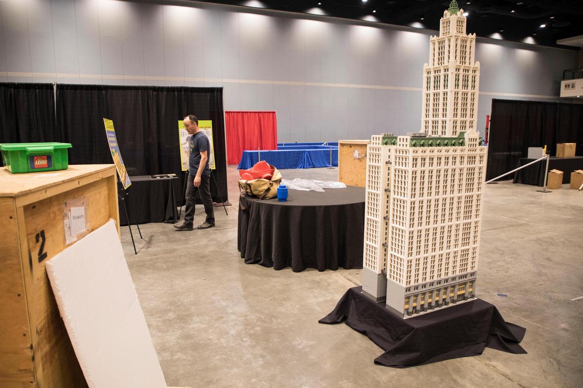 Jonathan Lopes, pictured here with his LEGO version of New York City’s Woolworth Building, prepares for this weekend’s LEGO fan convention, BrickUniverse, on Friday, March 8, 2019.
