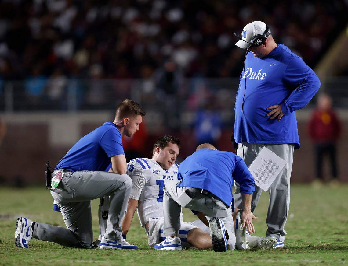 Duke’s Riley Leonard sits on the field after being injured during the second half of the Blue Devils’ 38-20 loss to Florida State on Saturday, Oct. 21, 2023, in Tallahassee, Fla.