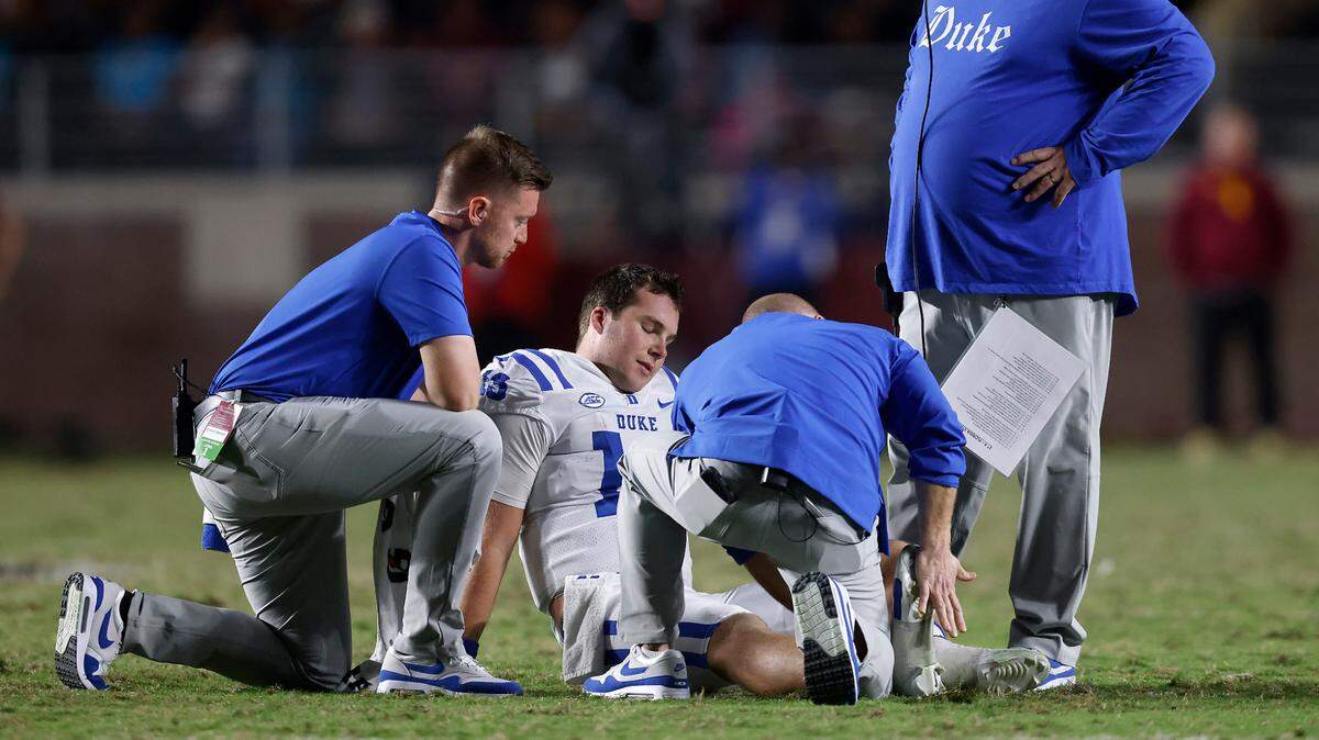Duke’s Riley Leonard sits on the field after being injured during the second half of the Blue Devils’ 38-20 loss to Florida State on Saturday, Oct. 21, 2023, in Tallahassee, Fla.