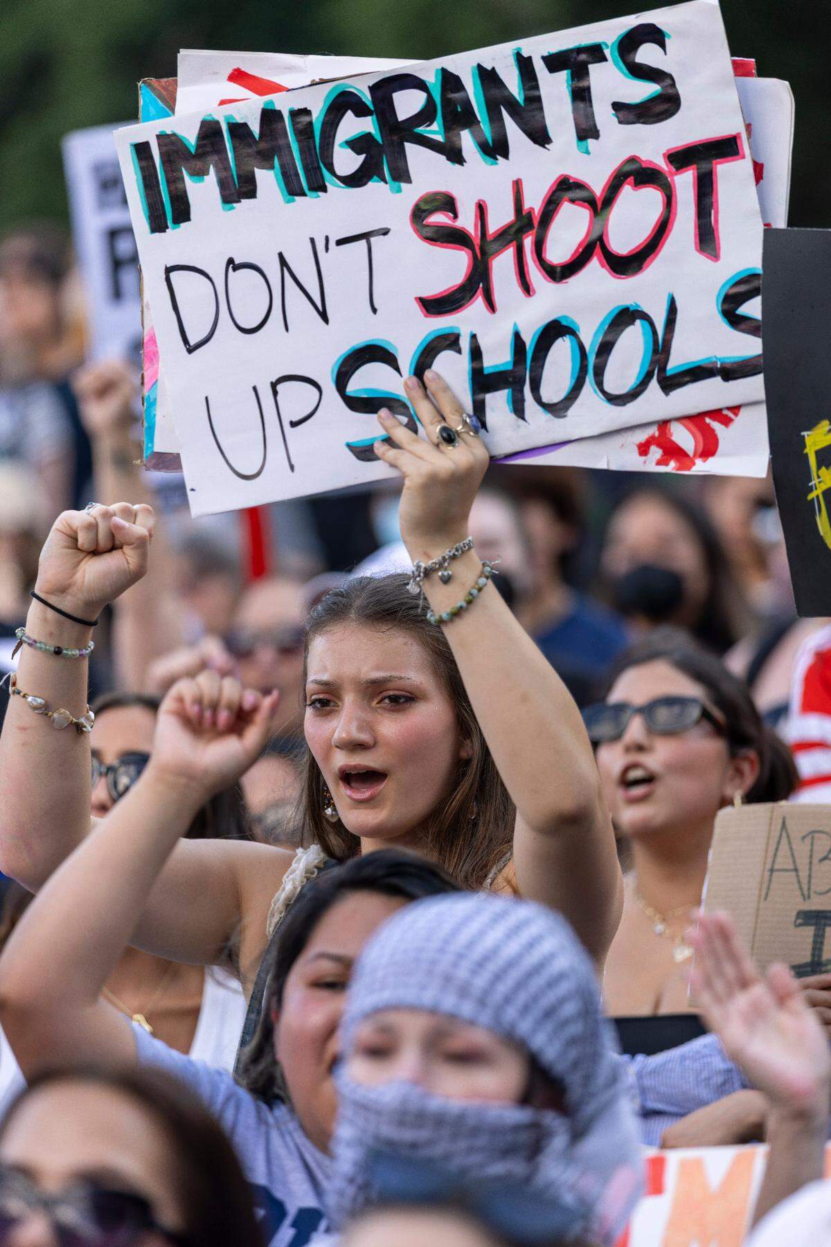 Samantha Rinker of Wilmington, N.C. rallies with hundreds of fellow demonstrators in Moore Square calling for immigration reform during the ‘Ice out of Raleigh’ rally on Wednesday, June 11, 2025 in Raleigh, N.C.