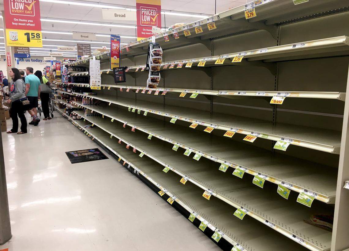 The bread shelves at the Woodcroft Food Lion are empty Monday, Sept.11, 2018 in Durham, N.C.  Residents of eastern and central North Carolina are stripping grocery shelves and emptying supplies of gasoline as Hurricane Florence approaches the Old North State.
