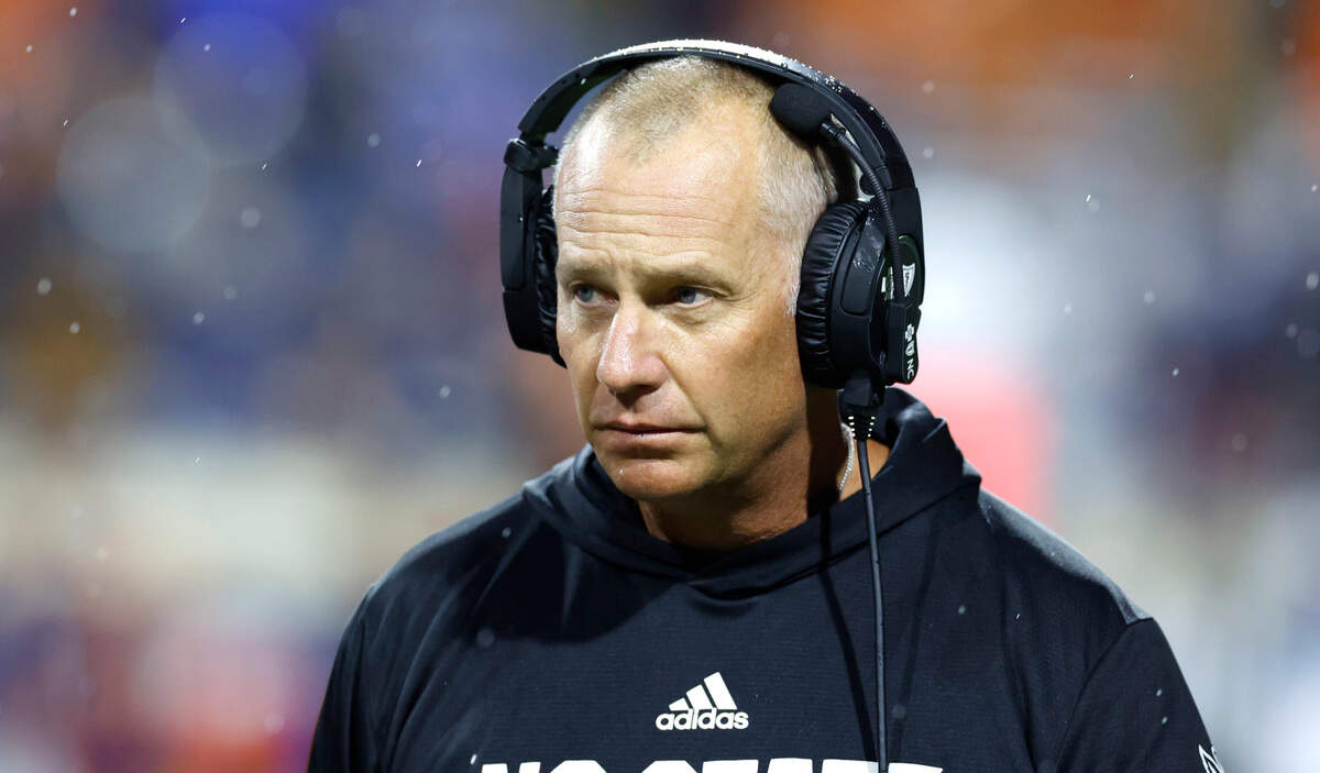 N.C. State head coach Dave Doeren walks on the field during a timeout in the second half of N.C. State’s 24-21 victory over Virginia at Scott Stadium in Charlottesville, Va., Friday, Sept. 22, 2023.