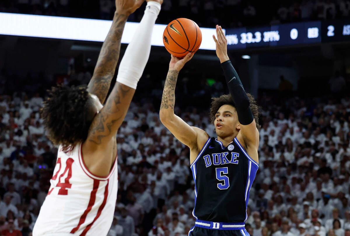 Duke’s Tyrese Proctor (5) hits a three-pointer during the first half of Duke’s game against Arkansas at Bud Walton Arena in Fayetteville, Ark., Weds. Nov. 29, 2023.